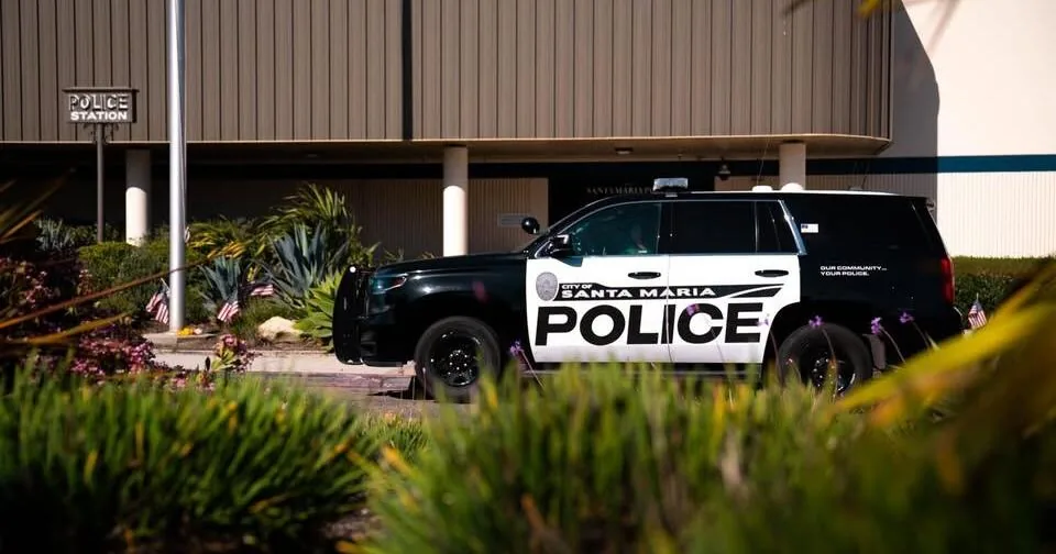 Santa Maria police vehicle parked near an investigation scene at night