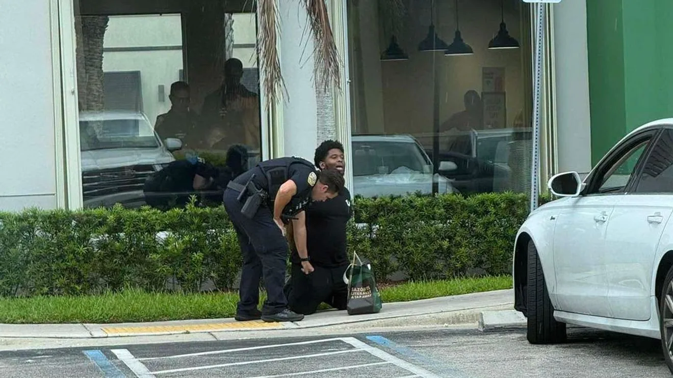 Police vehicles and crime scene tape surround a Pollo Tropical in Port St. Lucie