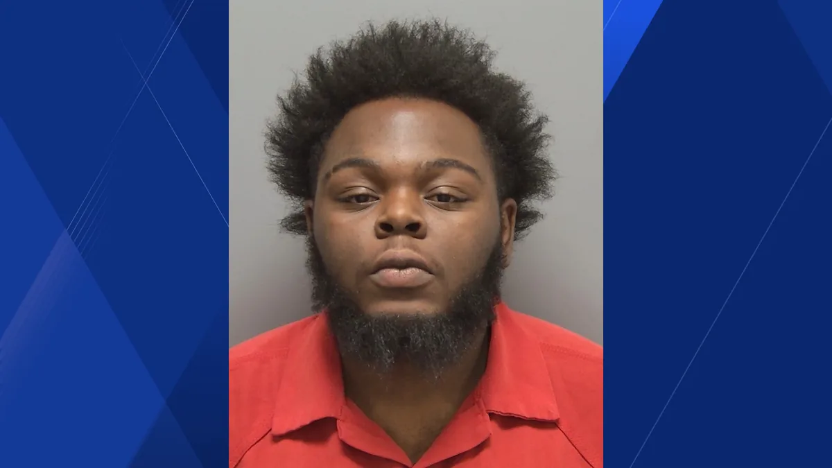 Wanted notice for a Lehigh Acres man accused of armed robbery and cutting off an ankle monitor