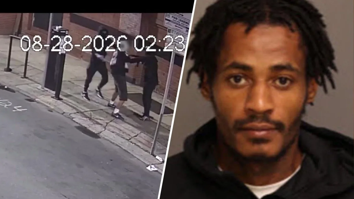 Philadelphia police investigate an armed robbery scene in Center City near Sansom Street